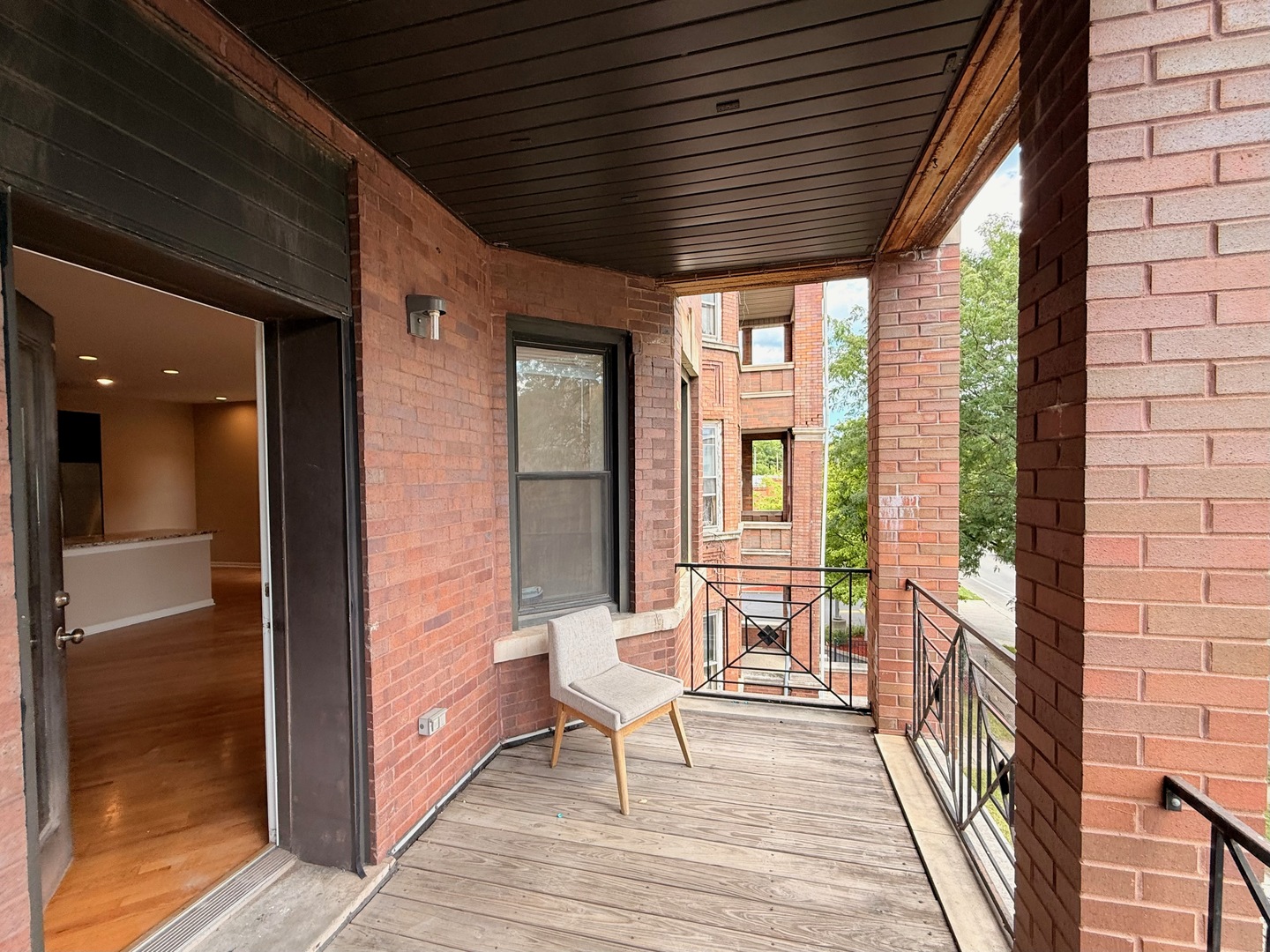 1534 East Marquette Road Chicago, IL 60637 - Photo 10 of 23 a view of an entryway with wooden floor and windows