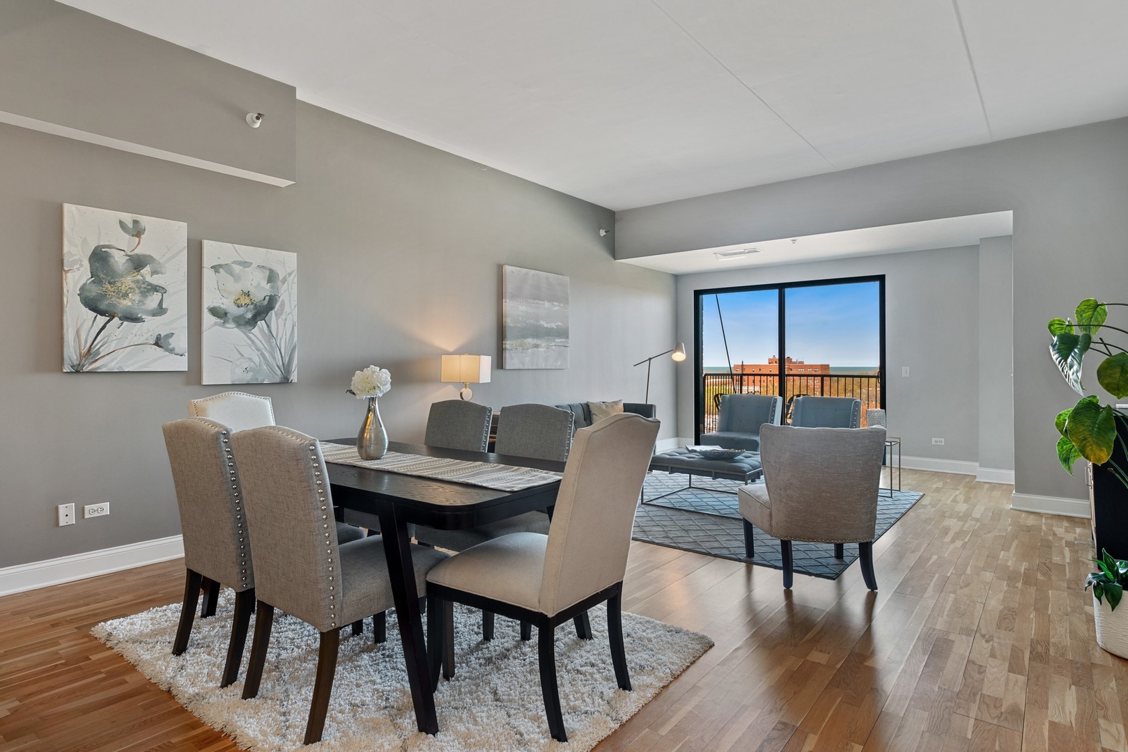 4848 North Sheridan Road, Unit 809 Chicago, IL 60640 - Photo 11 of 45 a dining room with furniture and wooden floor