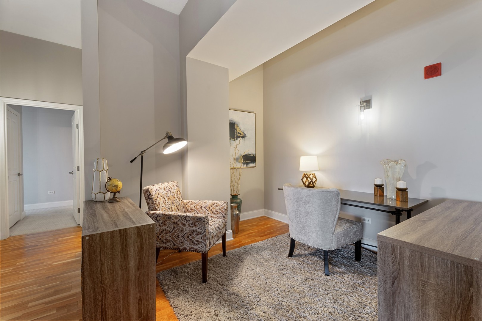 4848 North Sheridan Road, Unit 809 Chicago, IL 60640 - Photo 12 of 45 a living room with furniture and a wooden floor