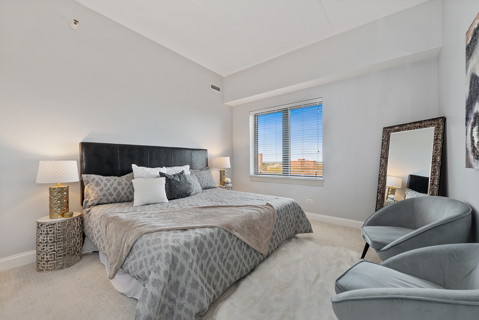 4848 North Sheridan Road, Unit 809 Chicago, IL 60640 - Photo 13 of 45 a bedroom with a bed and a couch