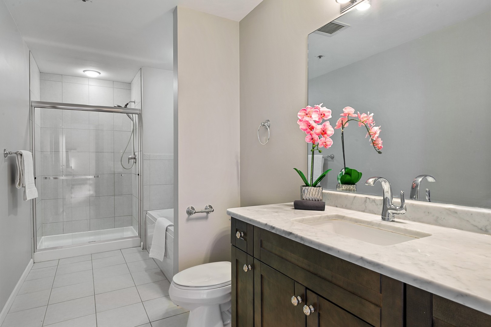 4848 North Sheridan Road, Unit 809 Chicago, IL 60640 - Photo 14 of 45 a bathroom with a granite countertop sink a toilet and shower