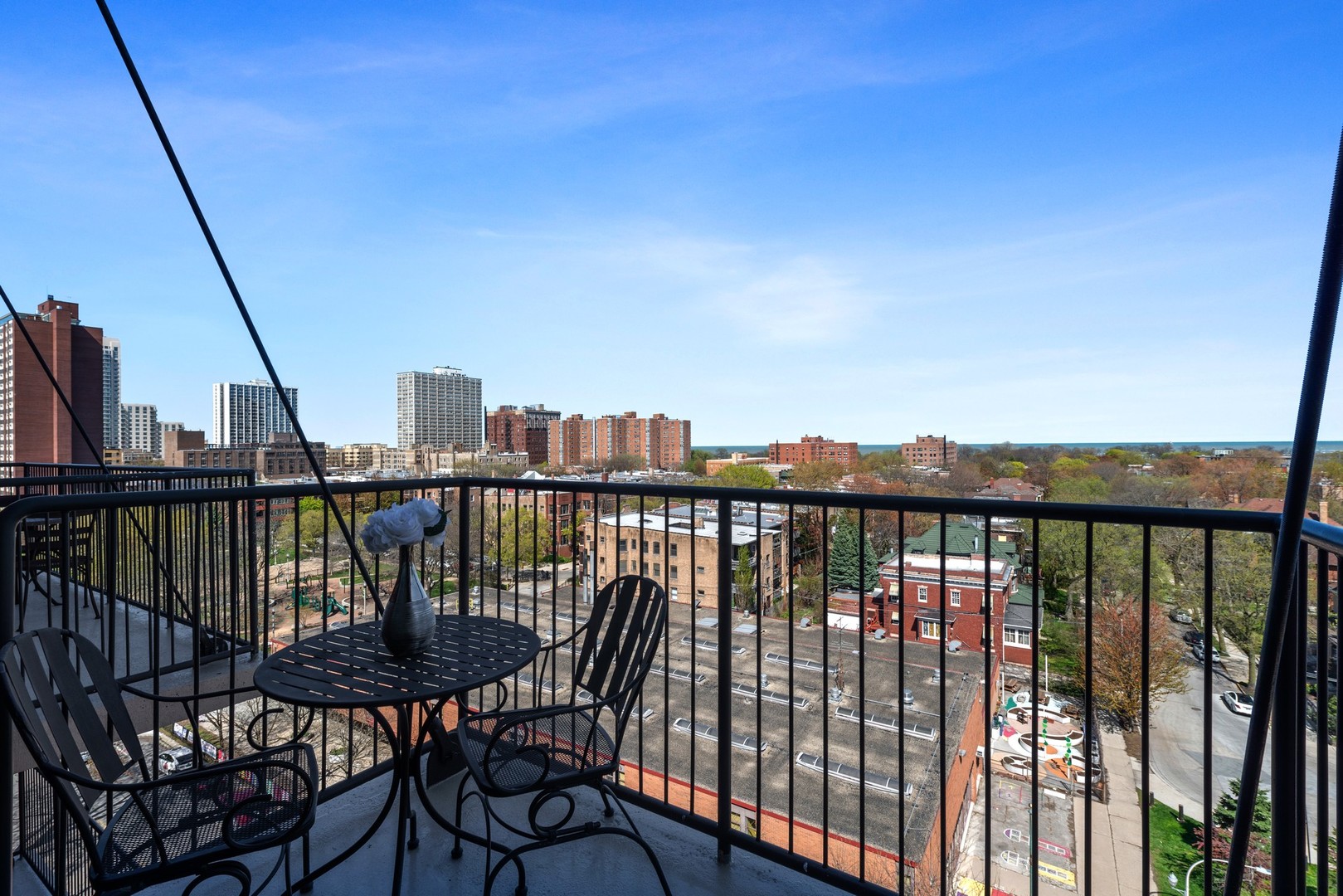 4848 North Sheridan Road, Unit 809 Chicago, IL 60640 - Photo 18 of 45 a view of a balcony with wooden chairs