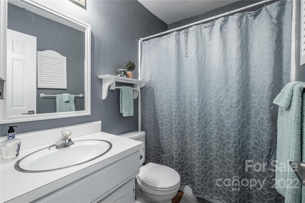 8346 Knights Bridge Road Charlotte, NC 28210 - Photo 18 of 29 a bathroom with a sink toilet and shower