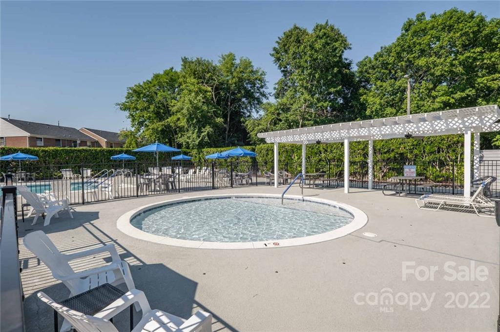 8346 Knights Bridge Road Charlotte, NC 28210 - Photo 26 of 29 a swimming pool with outdoor seating and yard