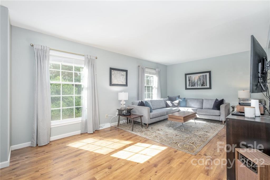 8346 Knights Bridge Road Charlotte, NC 28210 - Photo 6 of 29 a living room with furniture window and wooden floor