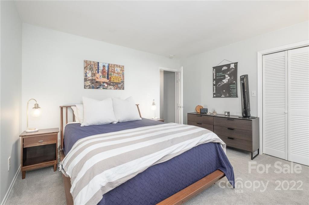 8346 Knights Bridge Road Charlotte, NC 28210 - Photo 10 of 29 a bedroom with a bed and a desk