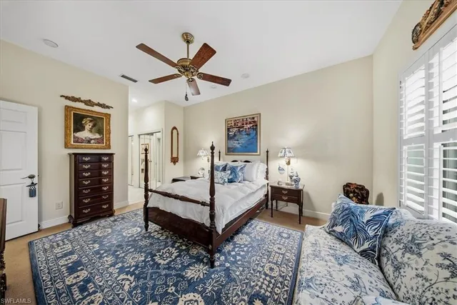 a bed room with a bed and a window