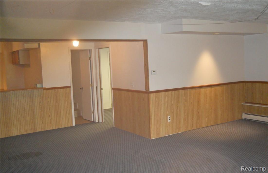 4237 Rurik Drive Howell, MI 48843 - Photo 23 of 37 basement rec room towards bed & bath