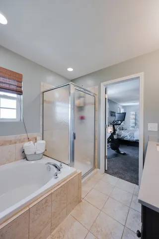 a en suite bathroom with a sink and a mirror