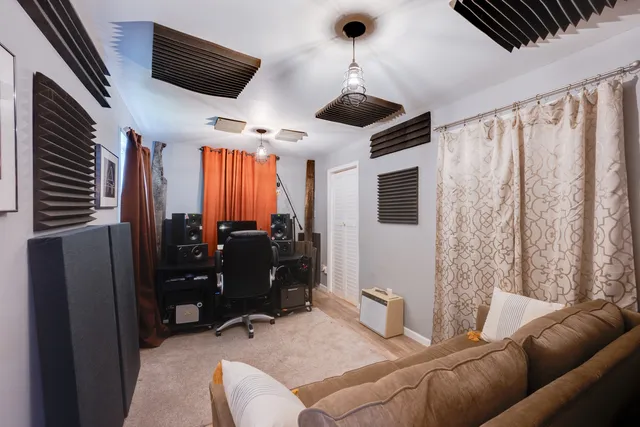 a view of a chair and table in backyard of the house