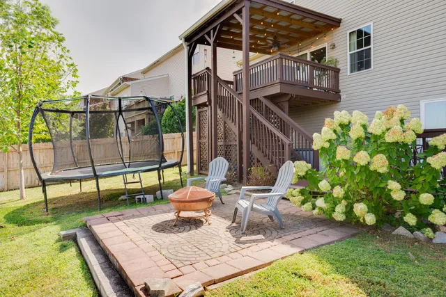 a view of a patio with table and chairs