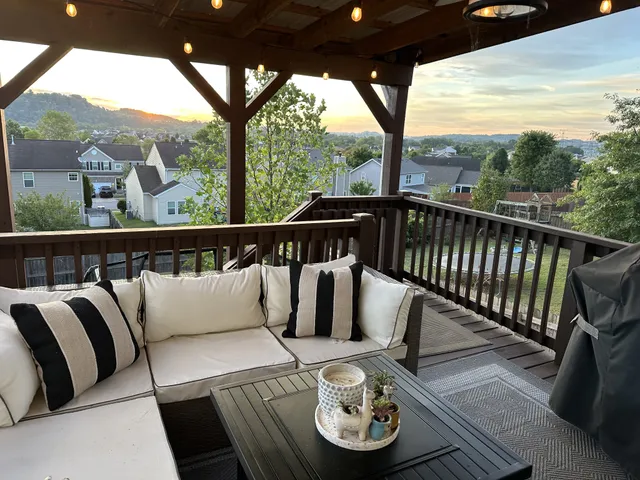a view of roof deck with furniture