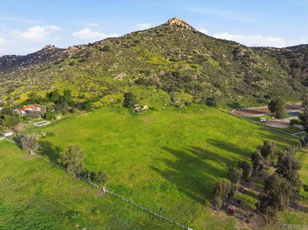 a view of a town with mountains in the background