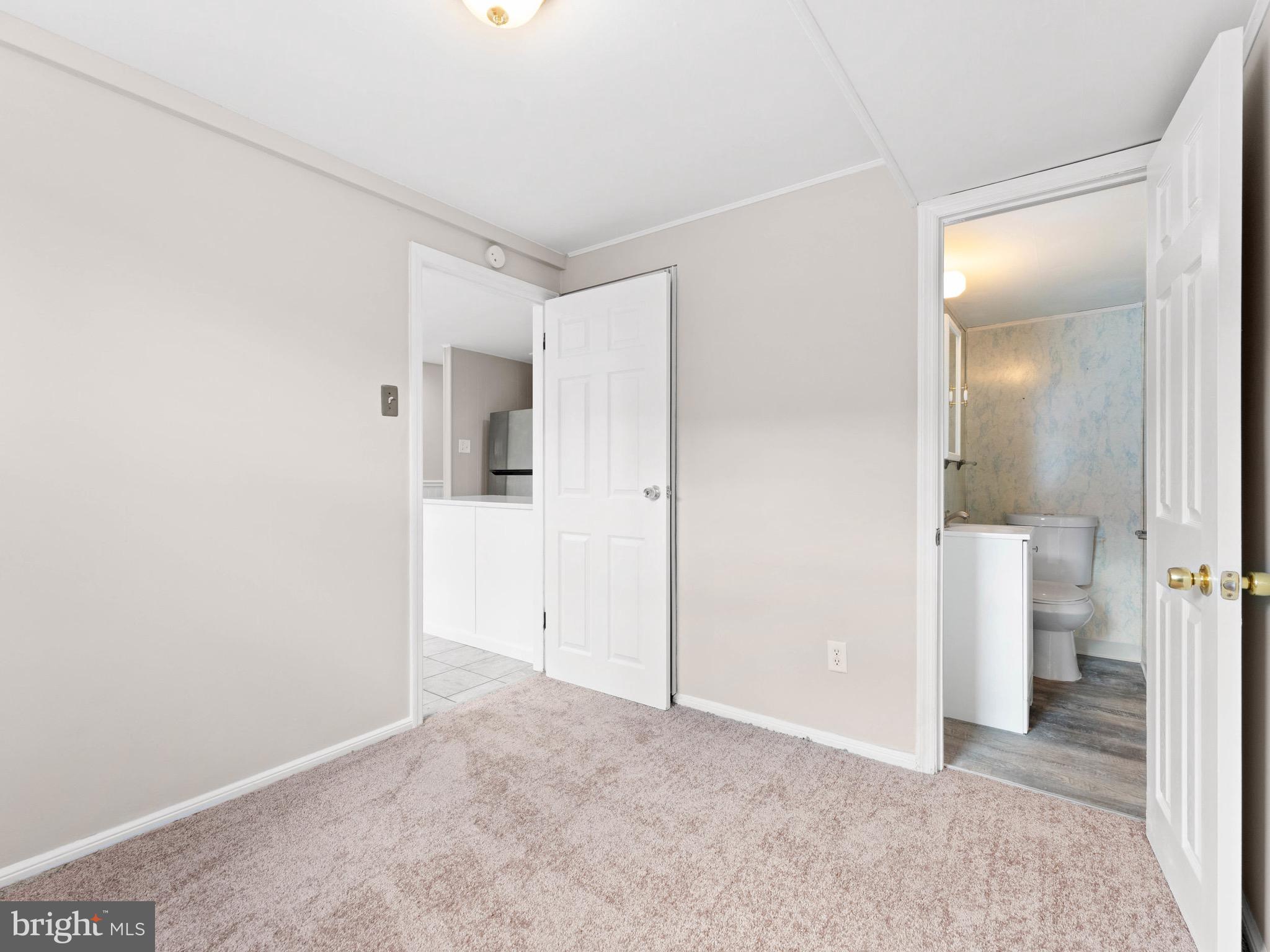 111 Ervin Avenue Marcus Hook, PA 19061 - Photo 13 of 37 an empty room with a bathroom and a bathroom