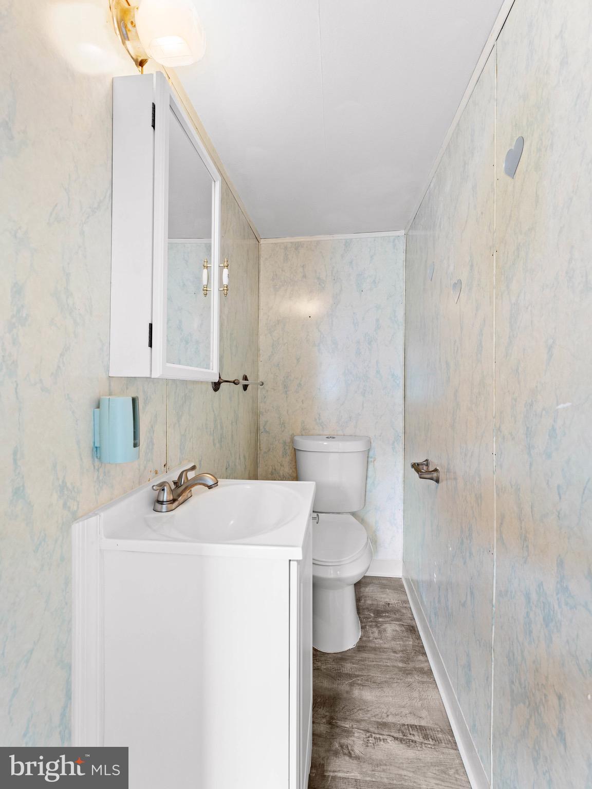 111 Ervin Avenue Marcus Hook, PA 19061 - Photo 14 of 37 a bathroom with a sink a toilet and shower