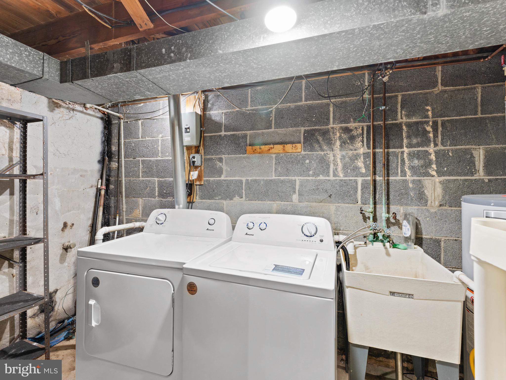 111 Ervin Avenue Marcus Hook, PA 19061 - Photo 25 of 37 a utility room with dryer and washer