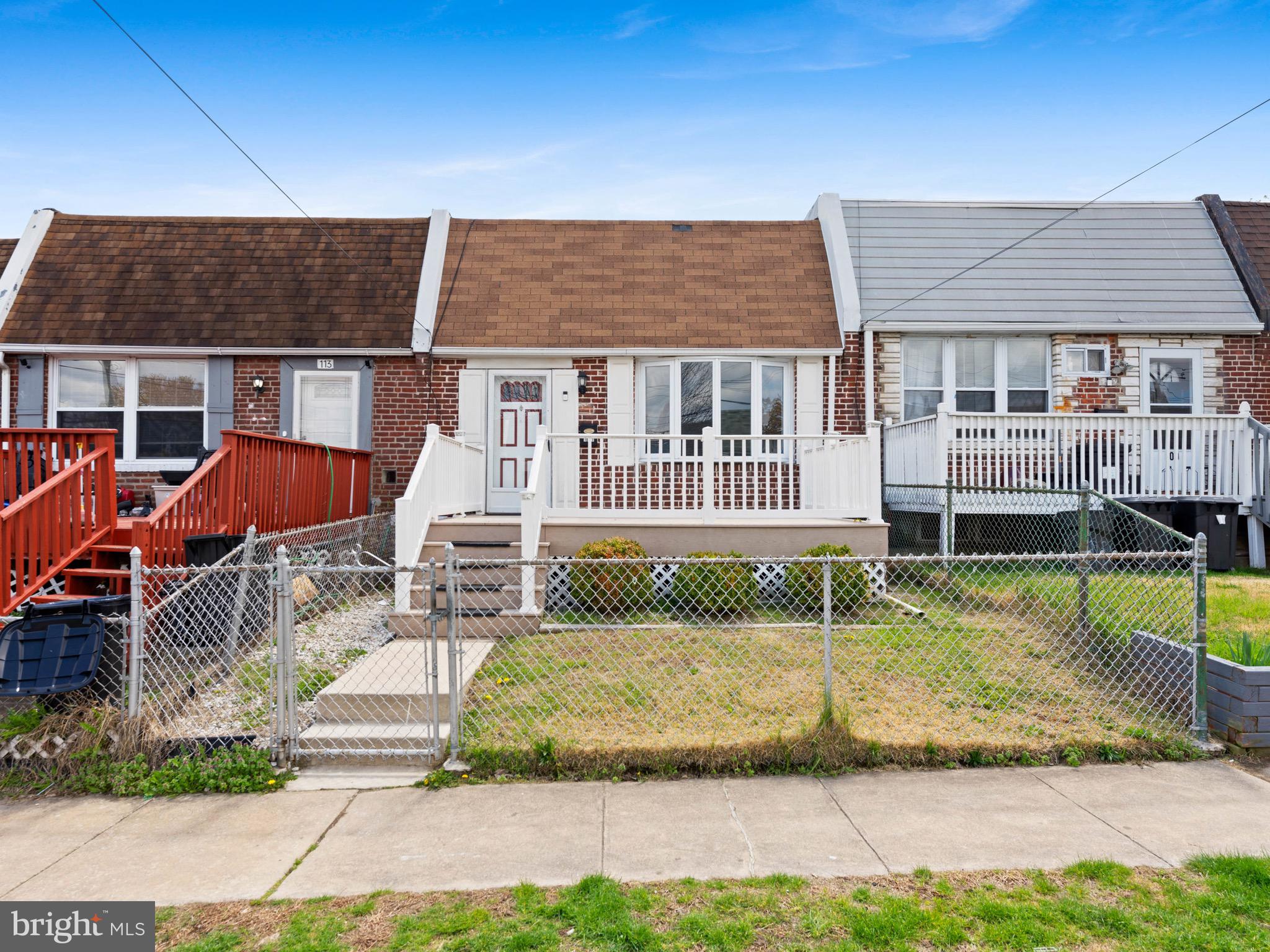 111 Ervin Avenue Marcus Hook, PA 19061 - Photo 3 of 37 a front view of a house with a yard