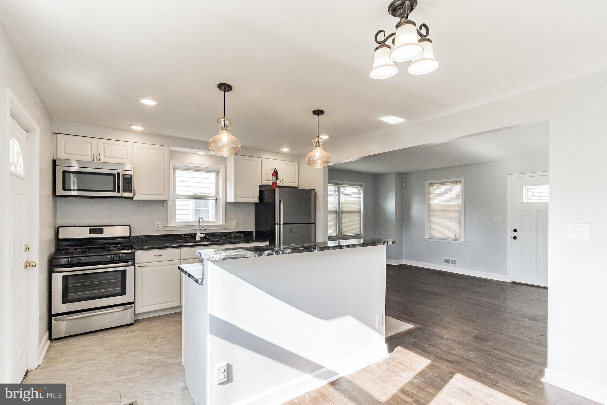 1811 Wendover Road Baltimore, MD 21234 - Photo 6 of 28 Renovated kitchen with stainless steel appliances
