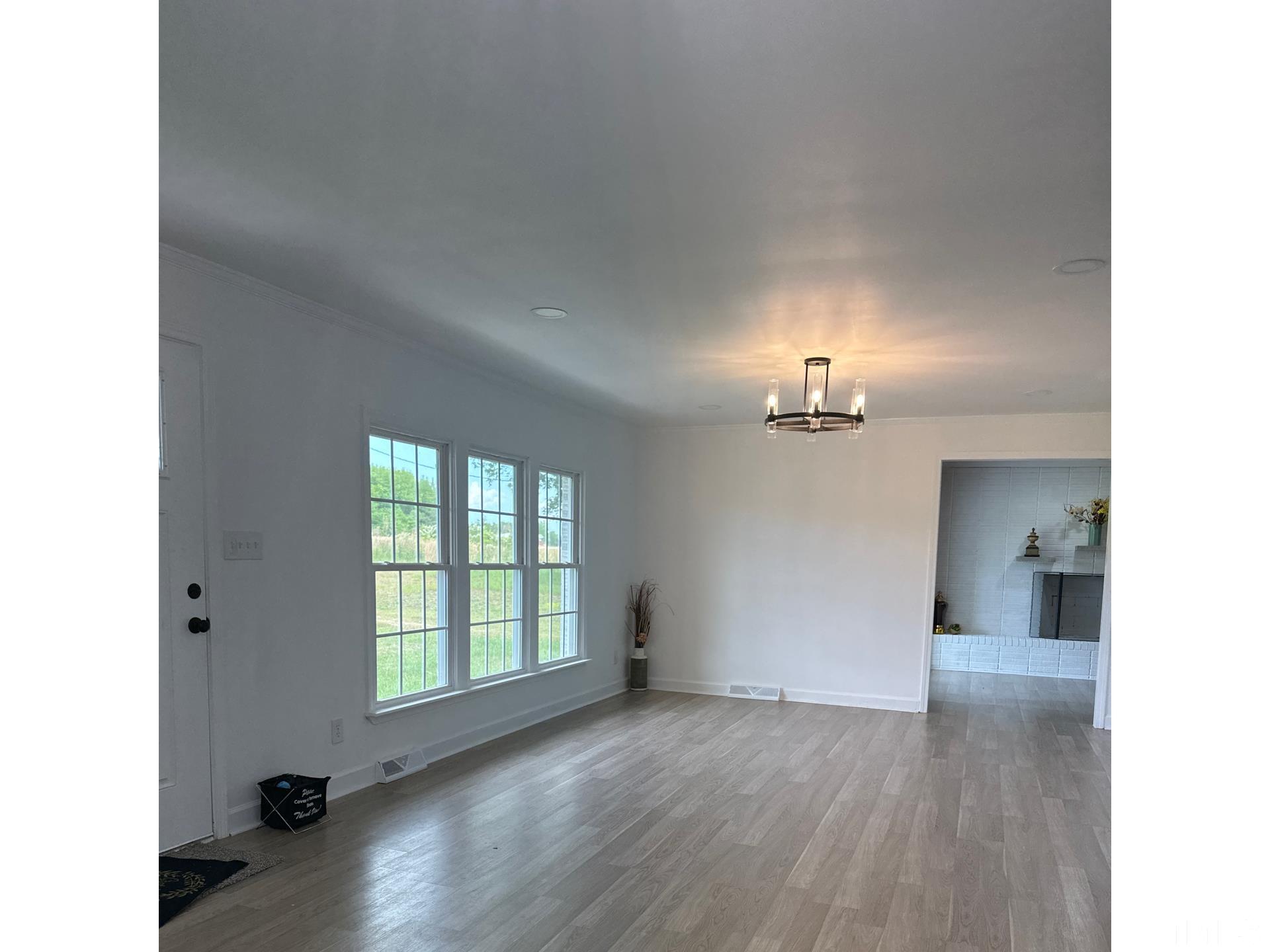 216 Trinity Church Road Louisburg, NC 27549 - Photo 11 of 28 a view of a room with wooden floor