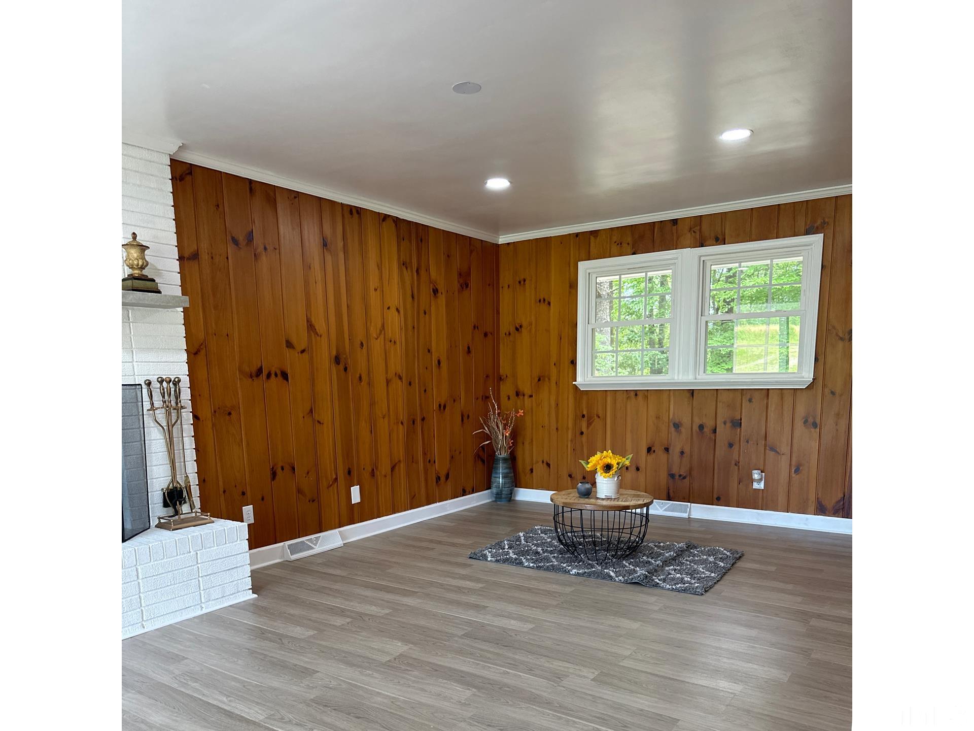 216 Trinity Church Road Louisburg, NC 27549 - Photo 12 of 28 a living room with furniture and wooden floor