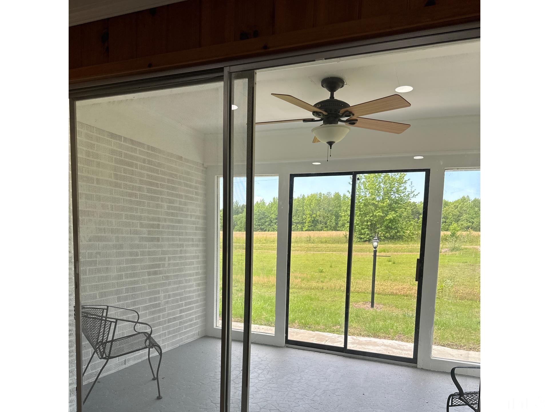 216 Trinity Church Road Louisburg, NC 27549 - Photo 15 of 28 a view of a livingroom with a ceiling fan and window