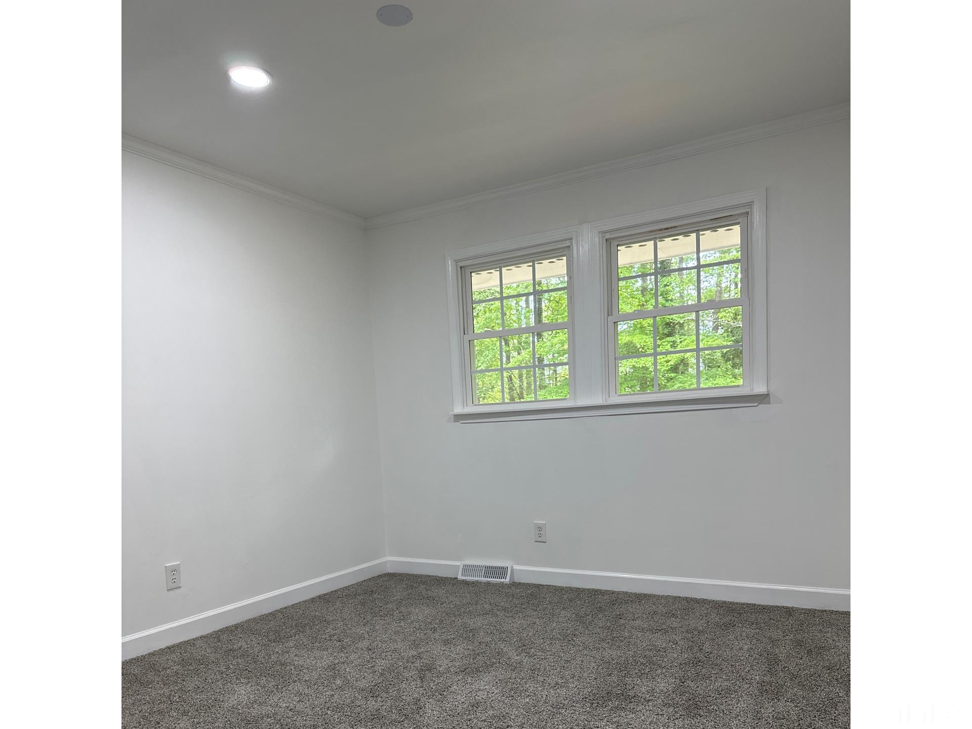 216 Trinity Church Road Louisburg, NC 27549 - Photo 16 of 28 an empty room with windows