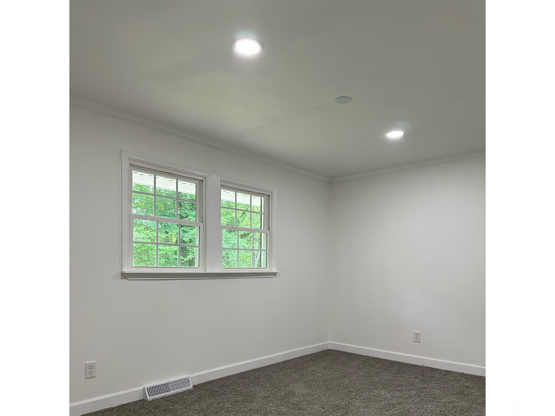 216 Trinity Church Road Louisburg, NC 27549 - Photo 18 of 28 a big room with a window