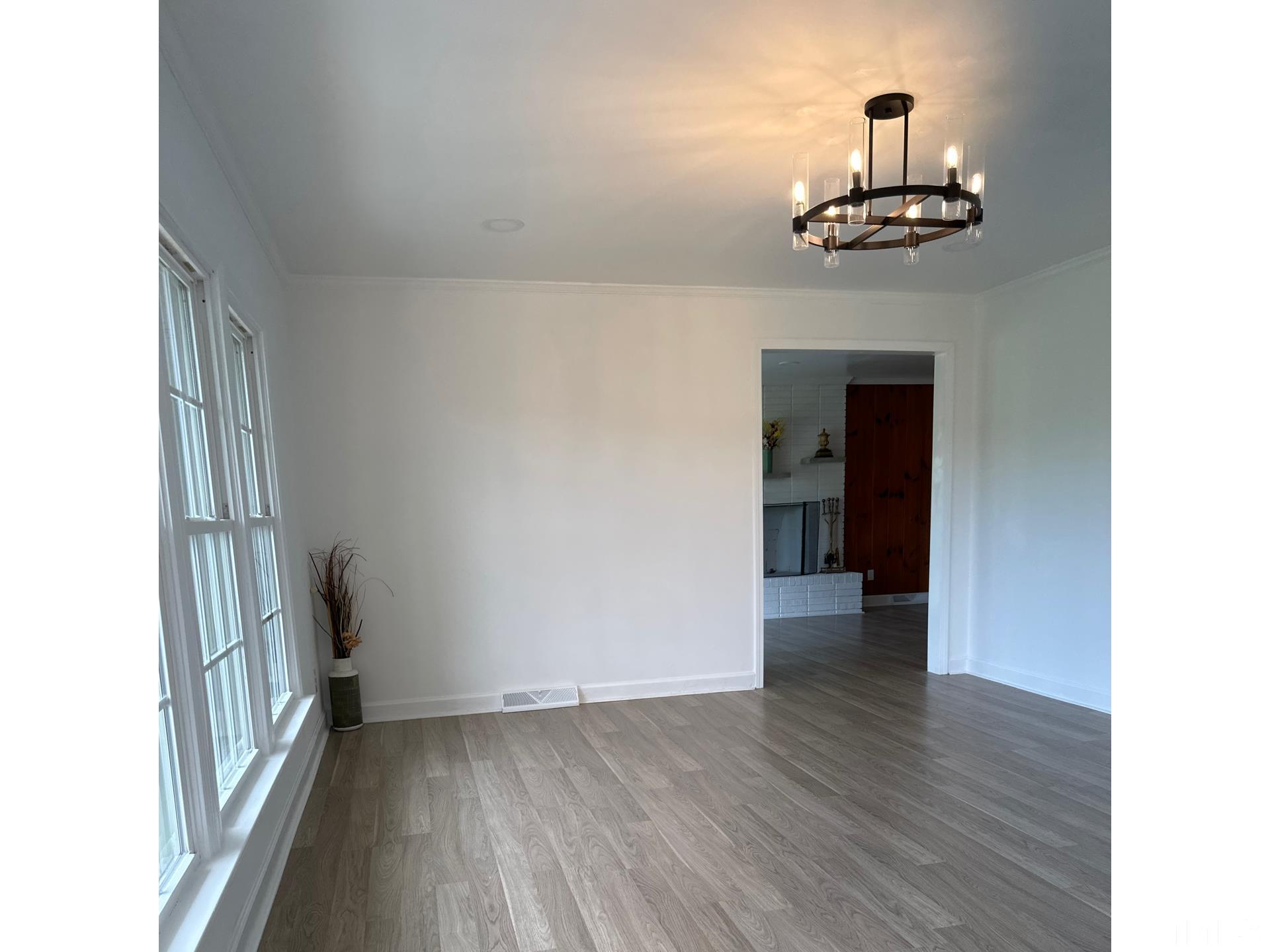 216 Trinity Church Road Louisburg, NC 27549 - Photo 2 of 28 a view of empty room with wooden floor