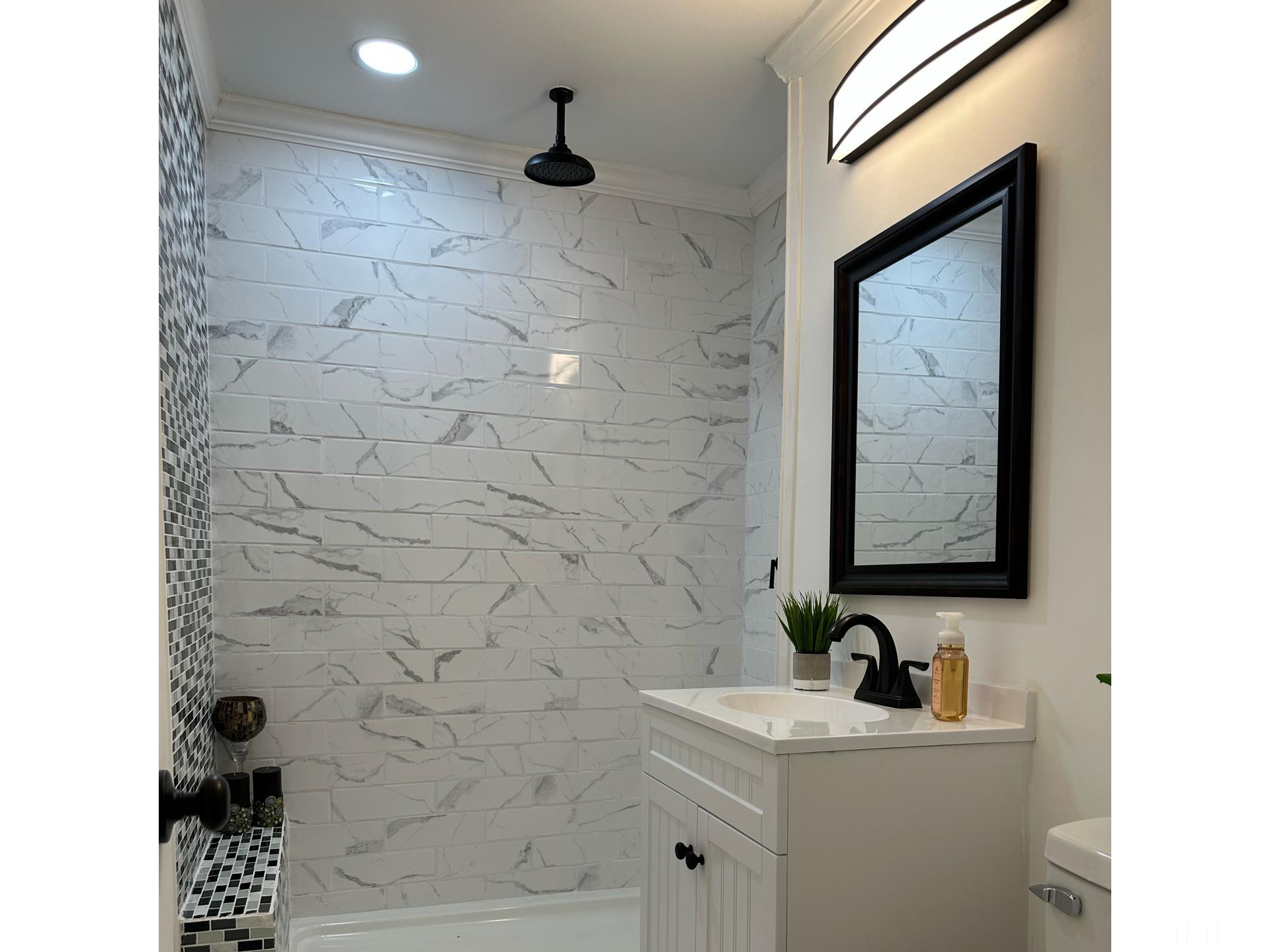 216 Trinity Church Road Louisburg, NC 27549 - Photo 23 of 28 a bathroom with a sink and a mirror