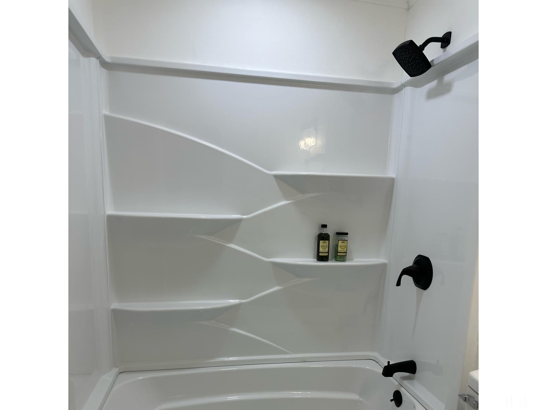 216 Trinity Church Road Louisburg, NC 27549 - Photo 25 of 28 a bathroom with a bathtub