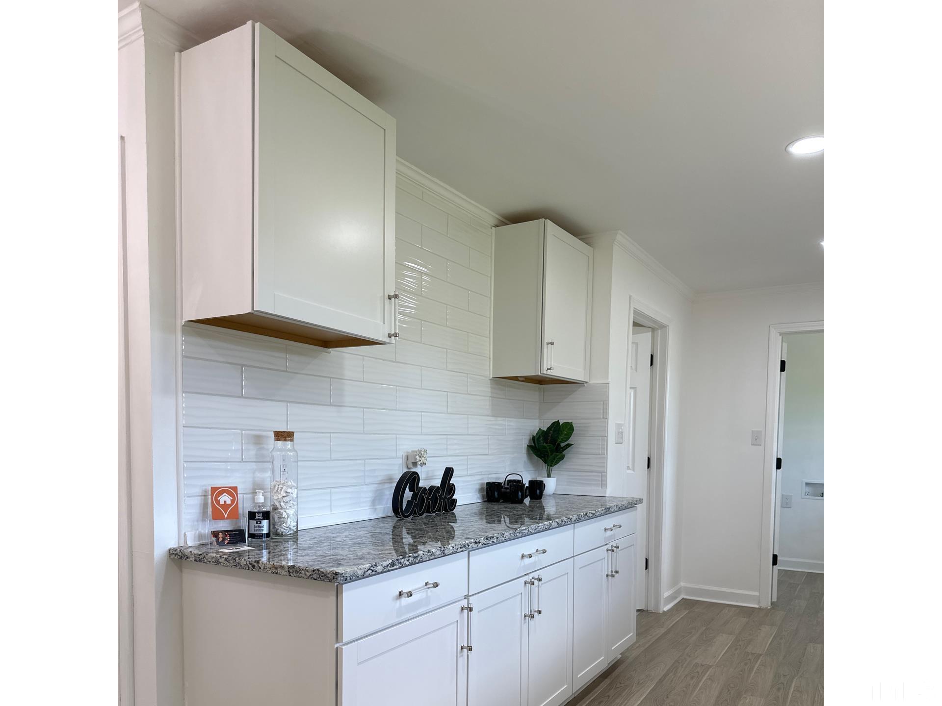 216 Trinity Church Road Louisburg, NC 27549 - Photo 5 of 28 a kitchen with a sink and cabinets
