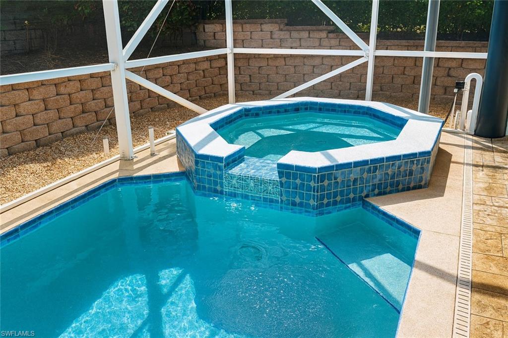 1975 San Marco Road Marco Island, FL 34145 - Photo 13 of 46 View of swimming pool with a patio and a pool with connected hot tub