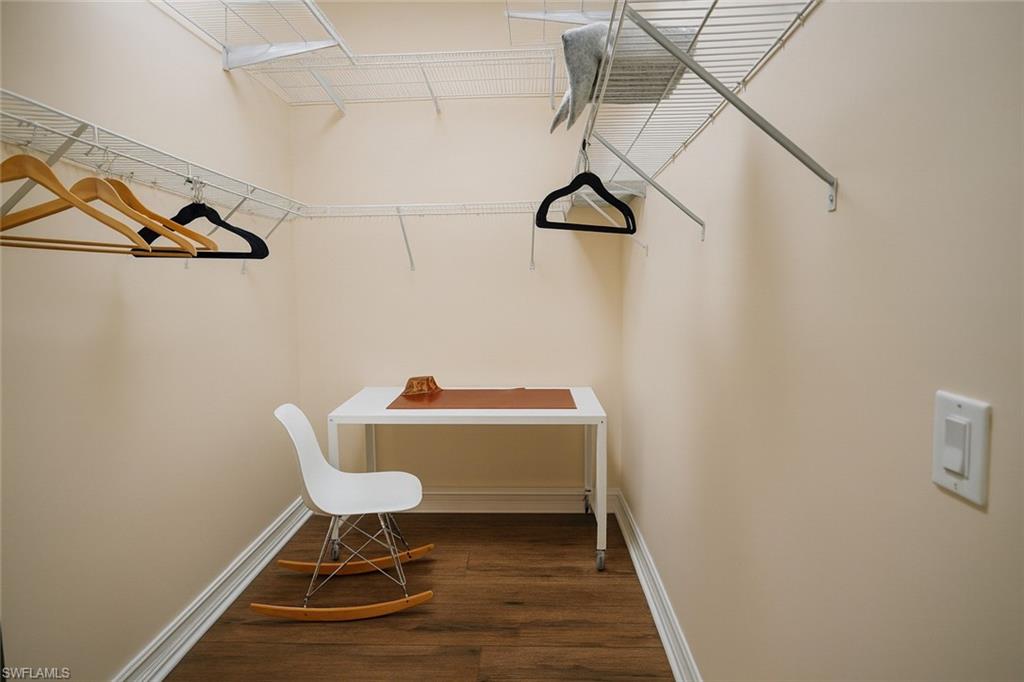 1975 San Marco Road Marco Island, FL 34145 - Photo 18 of 46 Spacious closet with dark wood finished floors