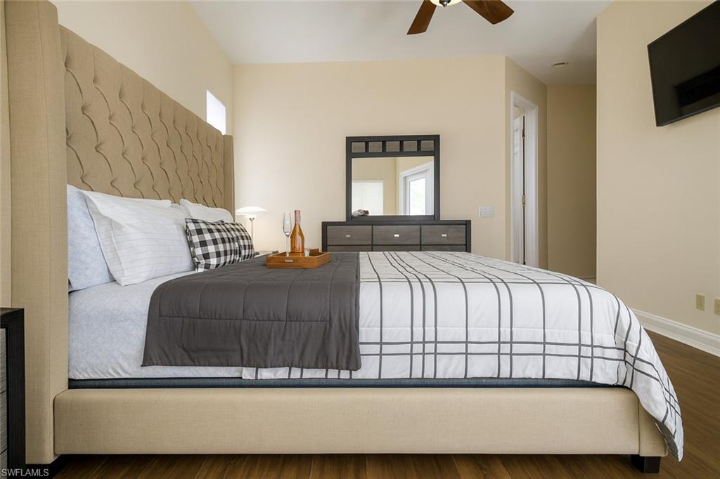 1975 San Marco Road Marco Island, FL 34145 - Photo 25 of 46 Bedroom with wood finished floors and ceiling fan