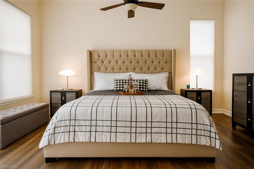 1975 San Marco Road Marco Island, FL 34145 - Photo 26 of 46 Bedroom with dark wood finished floors and ceiling fan