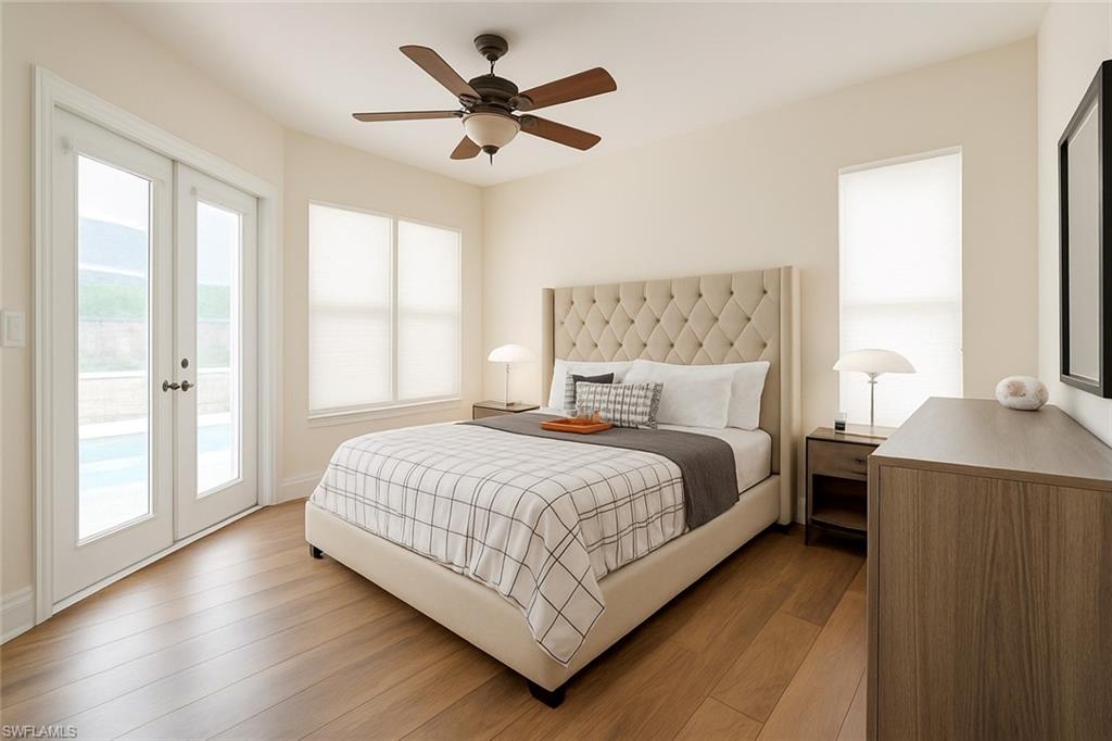 1975 San Marco Road Marco Island, FL 34145 - Photo 27 of 46 Bedroom with access to outside, french doors, wood finished floors, and ceiling fan