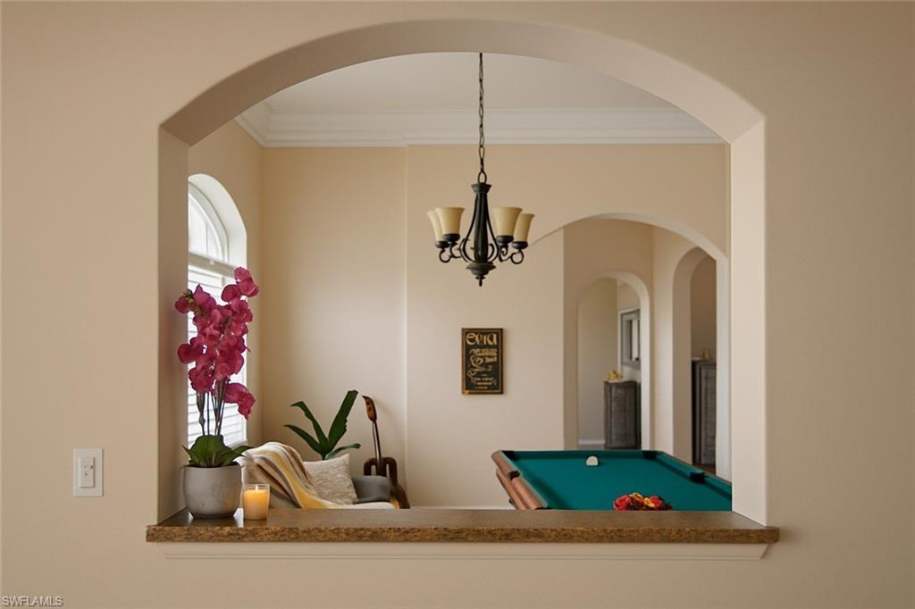 1975 San Marco Road Marco Island, FL 34145 - Photo 32 of 46 Game room featuring billiards, ornamental molding, arched walkways, and a chandelier