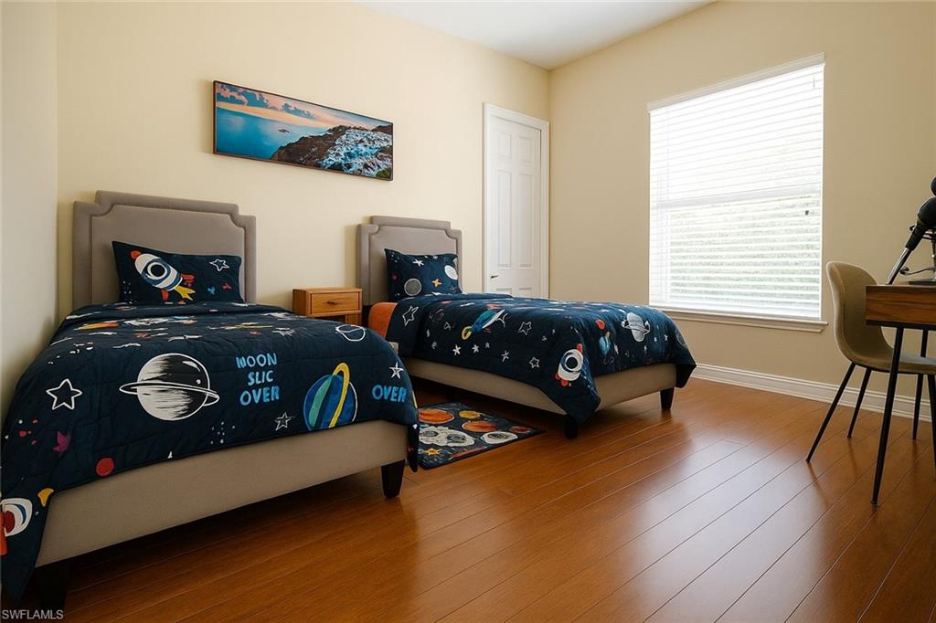 1975 San Marco Road Marco Island, FL 34145 - Photo 38 of 46 Bedroom featuring baseboards and wood finished floors