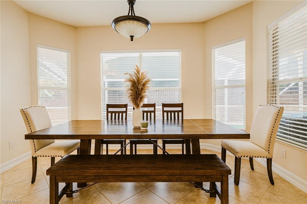 1975 San Marco Road Marco Island, FL 34145 - Photo 7 of 46 Dining area featuring plenty of natural light and light tile patterned floors
