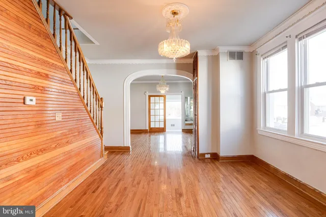 a view of gallery with wooden floor