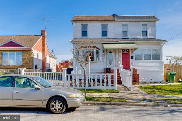 a car parked in front of a house