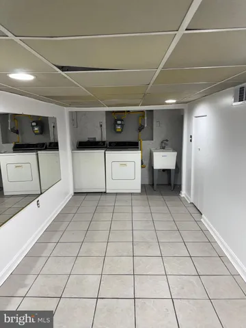 a utility room with cabinets