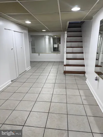 a view of entryway with stairs and a window