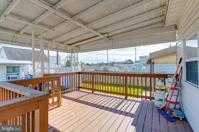 a view of balcony with wooden floor