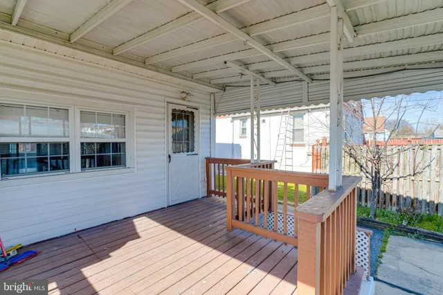 a view of a house with wooden deck