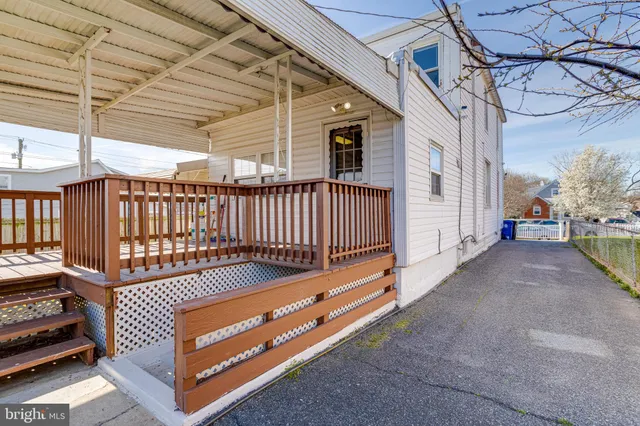 a view of a porch with wooden floor