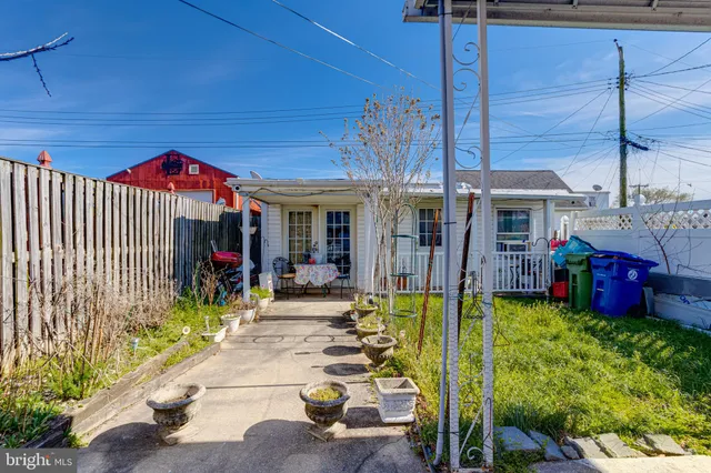 a front view of a house with swimming garden and patio