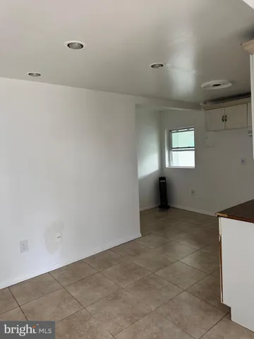 a view of an empty room with windows