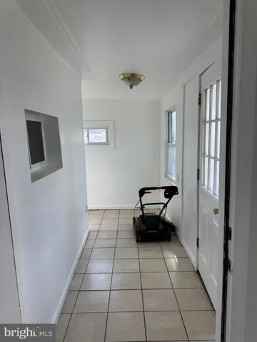 a view of empty room with windows