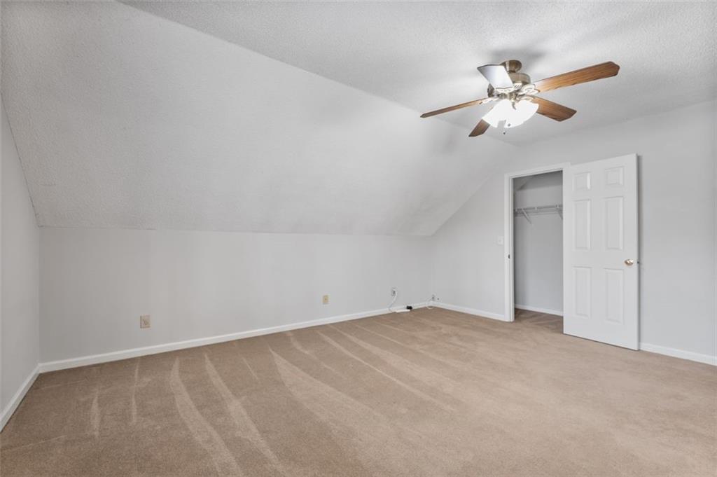 4803 Tarleton Drive Southwest Lilburn, GA 30047 - Photo 20 of 32 a view of an empty room